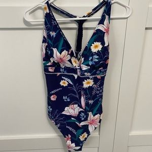 Navy floral one-piece. NWT size XL
